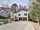Charming home with a two-car garage, complemented by a beautifully landscaped front yard and driveway at 4853 Chapelle Ct, Marietta, GA 30066