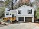 Charming two-story home with white siding, black shutters, and a two-car garage at 4853 Chapelle Ct, Marietta, GA 30066