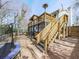 Multi-level exterior deck with a trampoline and stairs to an outdoor living space at 4853 Chapelle Ct, Marietta, GA 30066