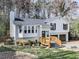 Beautiful two-story home with a bay window, white siding, dark shutters, and an attached garage at 4853 Chapelle Ct, Marietta, GA 30066