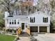 Charming two-story home featuring a well-manicured lawn, attached garage, and inviting front porch with steps at 4853 Chapelle Ct, Marietta, GA 30066