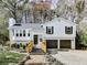 Charming two-story home with white siding, black shutters, and a two-car garage at 4853 Chapelle Ct, Marietta, GA 30066