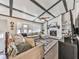 Inviting living room featuring a cozy fireplace, custom ceiling beams and a comfortable sectional couch at 4853 Chapelle Ct, Marietta, GA 30066