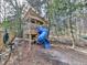 Outdoor wooden playhouse with slide, providing fun and entertainment for children at 4853 Chapelle Ct, Marietta, GA 30066