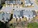 Overhead shot displays a neighborhood layout, highlighting property sizes and communal green spaces at 7316 Wagon Wheel Ct, Jonesboro, GA 30236