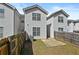 View of fenced backyard and homes at 7316 Wagon Wheel Ct, Jonesboro, GA 30236