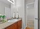 Bathroom boasts vanity with granite counters, and white flowers for a fresh touch at 7316 Wagon Wheel Ct, Jonesboro, GA 30236