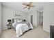 Bright bedroom with a cozy bed, soft carpet, ceiling fan, and calming decor at 7316 Wagon Wheel Ct, Jonesboro, GA 30236