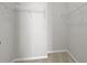Walk-in closet with metal shelving and carpeted floors at 7316 Wagon Wheel Ct, Jonesboro, GA 30236