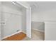 Hall closet featuring wood flooring and an access door at 7316 Wagon Wheel Ct, Jonesboro, GA 30236