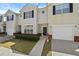 Charming townhome with a one-car garage, black shutters, and a well-maintained lawn at 7316 Wagon Wheel Ct, Jonesboro, GA 30236