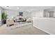 Bright living area featuring neutral carpet, soft seating and a ceiling fan at 7316 Wagon Wheel Ct, Jonesboro, GA 30236