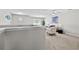 Upstairs living room area featuring grey carpet, a window and soft seating at 7316 Wagon Wheel Ct, Jonesboro, GA 30236