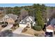 Stunning aerial view of a well-manicured home with a spacious three-car garage and established landscaping at 994 Fairview Club Cir, Dacula, GA 30019