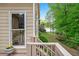 Deck view showcases beautiful lake views and a lush lawn with mature trees at 994 Fairview Club Cir, Dacula, GA 30019