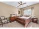 Bedroom with plush bedding, a ceiling fan, and furniture at 994 Fairview Club Cir, Dacula, GA 30019