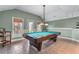 Spacious game room with a pool table, tile floor, and natural light at 994 Fairview Club Cir, Dacula, GA 30019