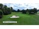 Aerial view of the Trophy Club of Apalachee golf course featuring lush green fairways and a sand trap at 994 Fairview Club Cir, Dacula, GA 30019