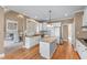 Bright kitchen featuring granite counters, stainless appliances, and hardwood floors at 994 Fairview Club Cir, Dacula, GA 30019
