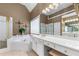 Luxurious main bathroom featuring a soaking tub, separate shower, and dual vanities at 994 Fairview Club Cir, Dacula, GA 30019