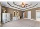 Spacious bedroom with tray ceilings, neutral colors, and carpet floors at 994 Fairview Club Cir, Dacula, GA 30019