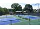 Well-maintained community pickleball courts with blue and green surfaces, perfect for recreation and leisure at 994 Fairview Club Cir, Dacula, GA 30019