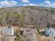 A captivating aerial view of the property nestled amongst a lush forest setting at 742 Wilkes Dr, Loganville, GA 30052