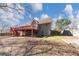 A spacious back yard with a raised wood deck and staircase at 742 Wilkes Dr, Loganville, GA 30052