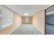 Unfinished basement offers potential with carpeted floor, window, and a door to another room at 742 Wilkes Dr, Loganville, GA 30052