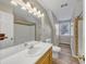 Bright bathroom featuring a single vanity, shower, and wood-look flooring, perfect for a modern and clean aesthetic at 742 Wilkes Dr, Loganville, GA 30052