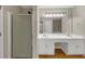 Bathroom showcasing double vanity and shower stall, offering a modern look at 742 Wilkes Dr, Loganville, GA 30052