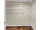 Walk-in closet with multiple shelves and carpeted floor, providing ample storage and organization at 742 Wilkes Dr, Loganville, GA 30052