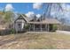 Well-maintained house with covered porch, dormer windows, and manicured lawn at 742 Wilkes Dr, Loganville, GA 30052