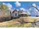 Well-maintained home features a charming porch and a spacious front yard at 742 Wilkes Dr, Loganville, GA 30052