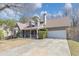 Charming home with a two-car garage, manicured landscaping, and covered porch at 742 Wilkes Dr, Loganville, GA 30052