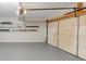 Clean garage interior with painted floor, shelving, and ample space for vehicles and storage at 742 Wilkes Dr, Loganville, GA 30052