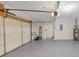 Well-maintained garage with epoxy floor, shelving, and storage capacity at 742 Wilkes Dr, Loganville, GA 30052