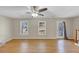 Spacious living room features hardwood floors, neutral walls, and staircase at 742 Wilkes Dr, Loganville, GA 30052