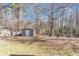View of backyard shed with neutral paint and white doors at 742 Wilkes Dr, Loganville, GA 30052