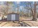 Close-up of a painted backyard shed with a white door at 742 Wilkes Dr, Loganville, GA 30052