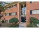 Charming brick building with black shutters, complemented by neat landscaping at 1111 Clairemont Ave # P5, Decatur, GA 30030