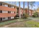 Exterior view of a brick apartment building with a well-maintained lawn at 1111 Clairemont Ave # P5, Decatur, GA 30030