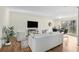 Open-concept living space with sleek furnishings, hardwood floors, and abundant natural light at 1111 Clairemont Ave # P5, Decatur, GA 30030