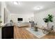 Inviting living area with wood floors, contemporary decor, and an open layout leading to dining area at 1111 Clairemont Ave # P5, Decatur, GA 30030