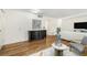 Bright living room with wood floors, dark sideboard, and neutral-toned furniture at 1111 Clairemont Ave # P5, Decatur, GA 30030