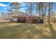Expansive backyard with a deck and wooded surroundings offering privacy at 1672 Zemory Dr, Tucker, GA 30084