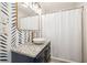 Stylized bathroom with granite vanity top and decorative lighting and fixtures at 1672 Zemory Dr, Tucker, GA 30084