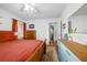 Bright primary bedroom with hardwood floors, colorful accents, and a window for natural light at 1672 Zemory Dr, Tucker, GA 30084