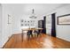Elegant dining room with hardwood floors, modern chandelier, and a gallery wall at 1672 Zemory Dr, Tucker, GA 30084