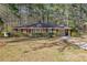 Charming single-story brick home with a well-manicured lawn and mature trees at 1672 Zemory Dr, Tucker, GA 30084